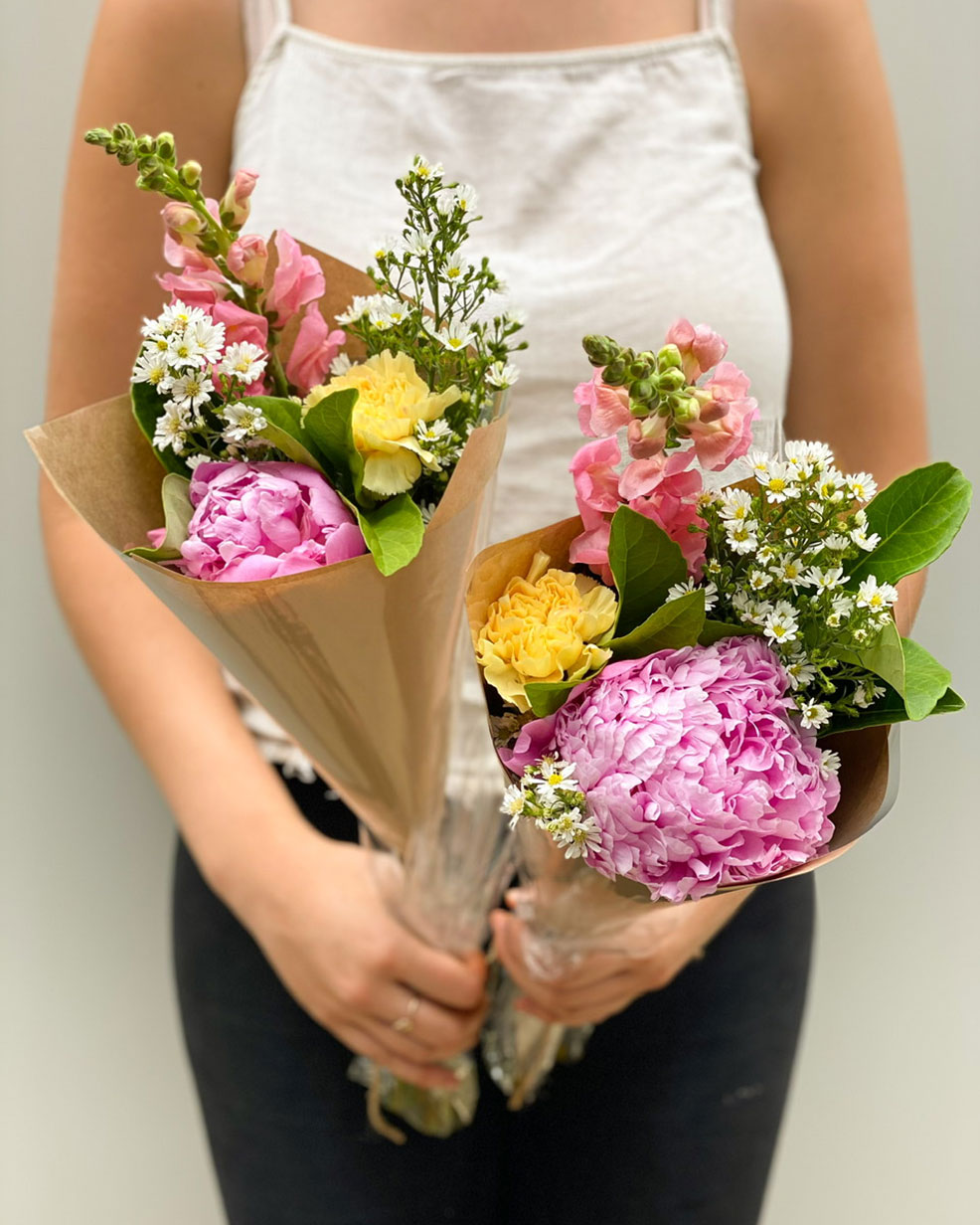Woman holding Flowers | Featured Image for the West End Landing Page For Poco Posy